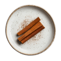 Cinnamon sticks arranged neatly on a simple plate against a plain transparent background highlighting their rich texture and warm color, Cinnamon in plate on transparent background png