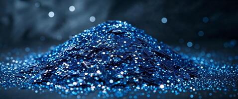 Sparkling blue glitter creates a mesmerizing texture in a dark setting. photo