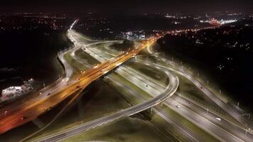 Aerial View of Highway Interchange at Night, A stunning aerial night view of a highway interchange with illuminated roads video
