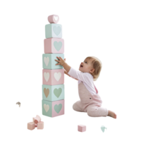 baby playing with heartshaped stacking blocks in nursery png