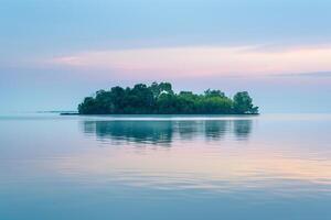 Serene Island at Dawn Reflecting Soft Pastel Hues Over Calm Waters in a Tranquil Setting photo