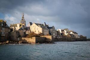 Roscoff town in Bretagne by cloudy sky photo