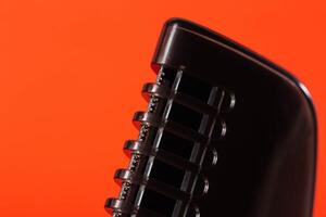 body attachment on a trimmer on a red background, close-up. Copy space for text. Electric photo
