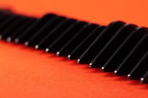 Set of edging attachments for trimmer on a red background, close-up. Copy space for text photo