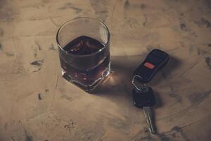 glass of whiskey and car key, photo