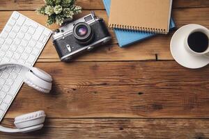 earphone with keyboard and notepad with camera photo