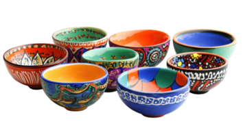 Colorful collection of decorative ceramic bowls arranged in an artistic display with intricate patterns and vibrant colors. png