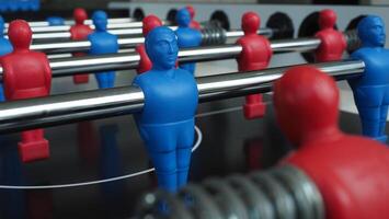Football table or soccer table game with plastic player figurine. Mini Soccer game which famous in past and be collectable item for foosball lover. Play by two hand control each row of player photo