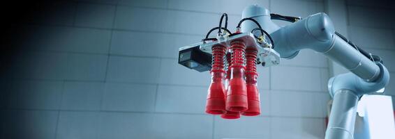 Robot arms Automation technology. Tools for saving energy effort and making the work of engineers more convenient in modern factories. Automation factory tech concept with robotic arms lifting goods. photo