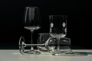 Assorted glassware for various drinks in sunlight. photo