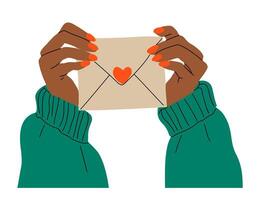 Female hands holding envelope with a heart on it. The hand is wearing red nail polish. The envelope is brown and the hand is wearing a green sweater vector