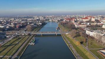 Aerial view of river and historic cityscape The Wisla a River Grunwald Bridge in the center of Krakow, Poland video
