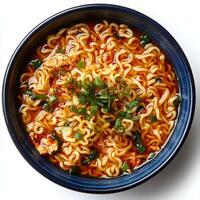 ramen noodles in bowl isolated on white background with shadow. wavy noodles in soup top view. spaghetti in asian cuisine photo