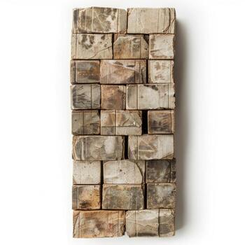 Stack of old, weathered, and textured bricks forming a rectangular shape photo
