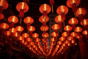 Rows of illuminated red lanterns creating a festive atmosphere at night photo