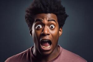 Shocked young man showing fear and surprise expression with wide open eyes and mouth photo