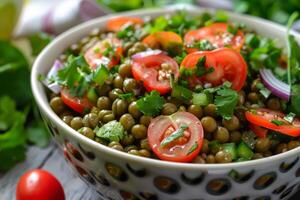 Green pea salad with tomatoes, onions and cilantro in bowl photo