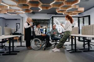 Young group of business people brainstorming together in a startup space, discussing business projects, investments, and solving challenges photo