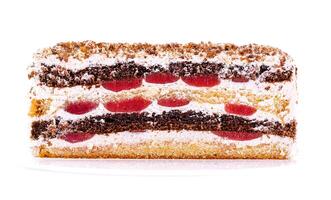 Layered cake with cherry filling and whipped cream displayed on a white background showcasing its textures and colors photo