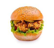Delicious sesame seed burger with crispy chicken, fresh vegetables, and vibrant toppings for a tasty meal photo