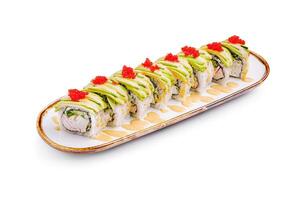 Fresh sushi rolls elegantly arranged on a decorative platter with vibrant toppings and sauces for a delightful dining experience photo