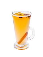 Warm spiced drink with cinnamon and cloves served in a clear glass cup on a white background at a cozy cafe photo