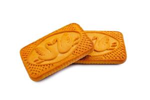 Delicate caramelized biscuits with swan design placed neatly on a white background photo