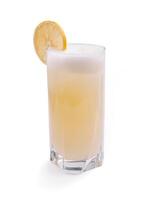 Refreshing lemon beverage in a tall glass garnished with a lemon slice and topped with frothy foam photo