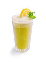 Refreshing citrus beverage with mint leaves served in a tall glass on a white background during the daytime photo