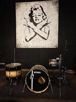 Kyiv, Ukraine - January 30, 2025 Tama Drum Kit in Studio With Artistic Portrait Background Wall Art Marilyn Monroe photo