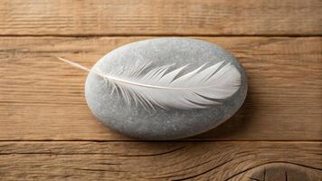 Death symbolized by a single white feather on a grey stone nature scene calm environment close-up view for reflection photo