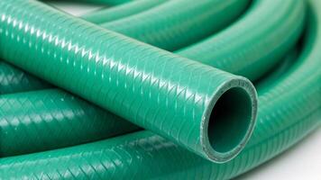 Close-up view of green flexible hose material indoor environment product photography detailed texture industrial context photo