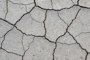 Cracked concrete surface material urban environment close-up view structural integrity concept photo