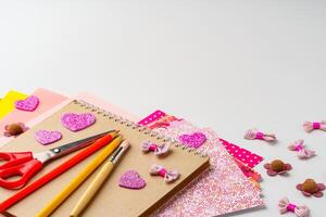 Crafting colorful decorations with paper, scissors, and embellishments on a tabletop photo