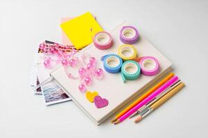 Crafting materials spread out on a table for creative DIY projects and scrapbooking activities photo