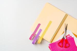 Crafting with vibrant paper and tools on a workspace ready for creative projects photo