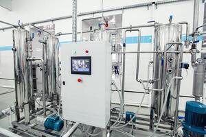 Modern industrial machinery in a clean facility for processing and manufacturing products in an advanced factory setting photo