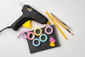 Creative crafting tools arranged on a workspace for art projects and decorations photo