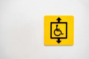 Sign indicating an accessible elevator for individuals with disabilities in a public space photo
