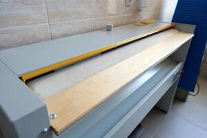 Woodworking machine for shaping and finishing in a workshop setting photo