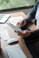 Graphic designer working with color palettes and digital tools in a creative space photo