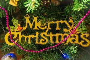 Christmas Card Merry Christmas and Happy New Year,Christmas tree in magic lights photo