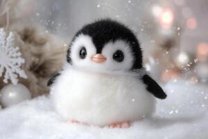 Cute baby penguin toy standing on snow during christmas time photo