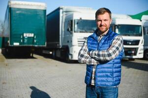 Portrait of confident truck driver on parking lot. Copy space.. photo