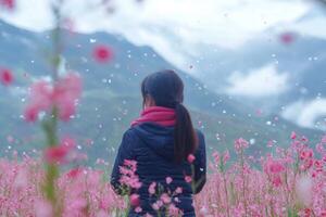 Tourist enjoying falling petals in malanhua flower field photo