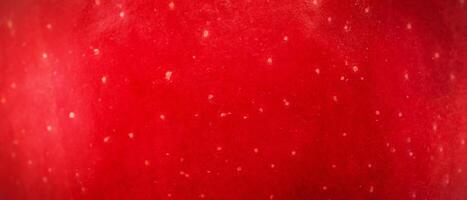 Texture of red apple skin macro photo banner size background.