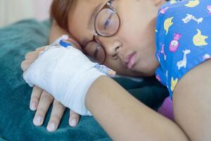 Sick children, infected with the virus, are lying and being treated in beds in hospitals. photo