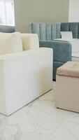 A selection of new sofas displayed in a contemporary furniture store video