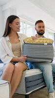 Couple Examining Mattress Features in Furniture Showroom video