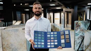 A tile seller displays a selection of color and texture samples video